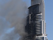 بالصور.. بدء التحقيق فى أسباب حريق فندق دبى بعد سيطرة قوات الإطفاء عليه