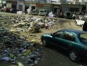 بالصور.. تلال القمامة تحاصر مدرسة الأنصارى الابتدائية فى السويس