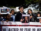 بالصور.. مظاهرات للديمقراطيين الاشتراكيين بـ"هونج كونج" ضد قرار ترامب