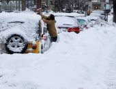 بالصور.. عاصفة ثلجية تجتاح عدة ولايات أمريكية