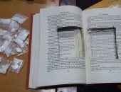 بالصور.. ضبط كوكايين مخبأ داخل "كتاب" فى طرد وارد من أمريكا