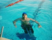 "على" من ذوى الاحتياجات الخاصة يحصد 15 ميدالية بالسباحة ويحلم بأولمبياد 2020