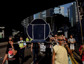 بالصور.. احياء الذكرى الرابعة لقمع مظاهرات الديمقراطية فى "هونج كونج"