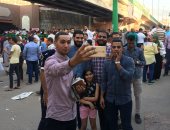 بالصور.. "السيلفى" أبرز احتفالات المواطنين بالعيد فى أسيوط 