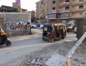 سكان حدائق الأهرام فى الجيزة يعانون من تهالك الطرق