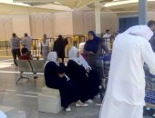 بالصور.. استقبال حافل للحجاج العائدين فى مطار القاهرة