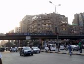 قارئ يرصد إضاءة أعمدة الكهرباء نهارا فى شارع التحرير بالدقى