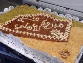 بالصور..مصر للطيران تحتفل بفوز الأهلي بـ"تورتة" على رحلتها القادمة من تونس