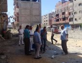 تنفيذ قرارات إزالة لعقارين مخالفين والتحفظ على معدات ومواد البناء بالإسكندرية