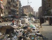 شكاوى من تراكم القمامة بالوراق.. والحى: "بنشيلها والأهالى بيرموا تانى"