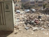 قارئ يشكو من تراكم القمامة فى تقاطع شارع زهنى بمنطقة الهرم