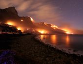 بالصور.. جهود مكثفة لإخماد حرائق الغابات فى جنوب إفريقيا