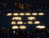 صور ..طلاب يحيون الذكرى الـ80 لمذبحة نانجينج فى الصين