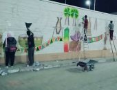 صور..تعرف فى خمس نقاط على مبادرات طلابية مبتكرة لتجميل حوائط أسوان