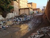 شكوى من تراكم القمامة ومياه الصرف بشارع 25 فى الإسكندرية