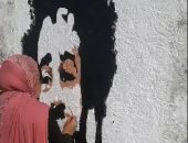 فيديو.. فنانة من الإسكندرية ترسم محمد صلاح على جدارية بسان ستيفانو