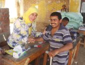 صور.. إقبال كبير لذوى الاحتياجات الخاصة على لجان الانتخابات بأسوان