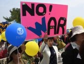 صور.. احتفالات فى كوريا الشمالية والجنوبية تحت شعار" نريد السلام و لا للحرب"