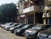 قارئ يرصد ترك أعمدة الكهرباء مضاءة نهارا فى شارع محمد شكرى بالزيتون