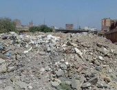 أكوام القمامة تحاصر محطة محولات كهرباء إمبابة والأهالى يطالبون برفعها