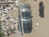 قارئ يشكو انتشار القمامة بشارع المستشفى العام فى المنصورة