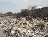 صور..أطنان القمامة فى جسر السويس تنذر بكارثة محققة لقربها من مستودع بترول