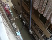 قارئ يشكو غرق شارع الفادى فى الهرم بمياه الصرف الصحى