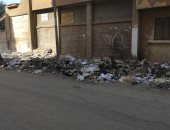 شكوى من تراكم القمامة بشارع مدرسة أحمد رمضان فى السويس