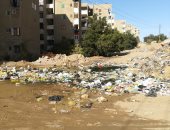 قارئ يشكو انتشار القمامة بعمارات التجاريين بأسوان