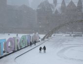 صور.. عاصفة ثلجية تضرب أمريكا وكندا وإلغاء مئات الرحلات الجوية 