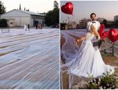 "عروسة" قبرصية تدخل موسوعة جينيس بأطول طرحة فى العالم.. صور