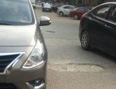 صور.. شكوى من تهالك الأسفلت بشارع عبد المنعم بالمهندسين