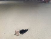 شكوى من حفرة فى شارع سريع أمام جامعة الزقازيق تهدد سلامة المارة