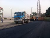 صور.. رصف باركينج بوابة استاد القاهرة الدولى وتزيين الشوارع قبل البطولة