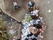 قارئ يشكو انتشار أكوام القمامة بأول نزلة كوبرى الملك فيصل بالجيزة
