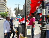 انتشار بائعى أعلام تونس فى شوارع السويس قبل مواجهة أنجولا.. صور