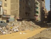 انتشار القمامة فى شارع ترعة عبد العال بالجيزة..والأهالى: نعيش فى وباء