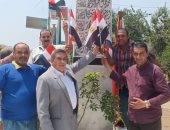 صور..اهالي كفر شكر بالقليوبية يحتفلون بذكرى ثورة 30 يونيو بالأعلام  والأغانى الوطنية