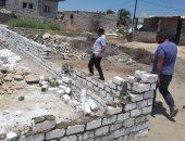 صور.. هدم سور مخالف واعادة رصف الطرق بالعامرية غرب الإسكندرية