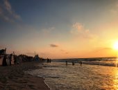 صور..شاطئ "ظلال النخيل" بالعريش مكان مفضل للاستمتاع بالهدوء ولحظات الغروب