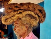 صور.. هندى لم يقص شعره منذ 40 عاما ويزعم: إن الله أخبرنى ألا أقصه