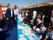 صور.. طلاب بورسعيد يرسمون معالمها السياحية والتاريخية على لوحة بطول 200 متر