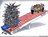 الحق فى شراء السلاح يعرض حياة الأمريكيين للخطر فى كاريكاتير "التايمز"