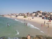 صور.. أهالى شمال سيناء يحتفلون برابع أيام العيد على شاطئ العريش