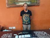 ضبط عاطل بنصف كيلو هيروين وسلاح نارى فى إمبابة