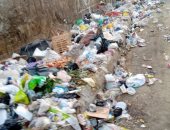 شكوى من انتشار القمامة بجوار سور مدرسه نجيب محفوظ بمساكن فيصل بالجيزه