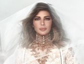 أصالة بفستان أبيض وطرحة: " نهاركم سعيد"