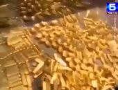 شاهد.. شرطة الصين تعثر على أطنان من الذهب فى منزل مسئول صينى سابق