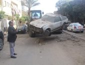 حملات لمصادرة السيارات المتهالكة فى أحياء القاهرة.. صور