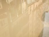 قارئ يشكو من وجود ماسورة مياه مكسورة بشارع مصطفى لطفى بالجيزة